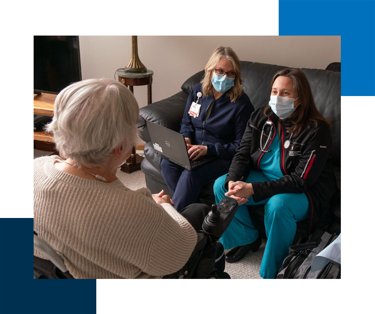 Photo of home health staff with a patient in their home